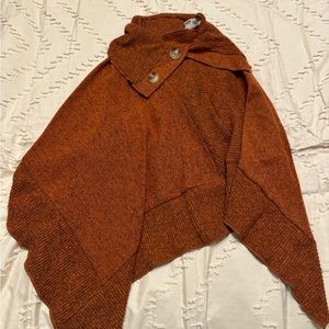 Brownish poncho.